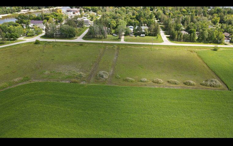 The Palmer Road lots from the air, with Palmer Road along the top and the village behind
